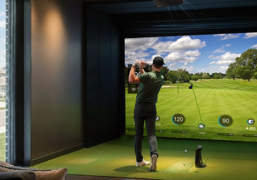 BenQ LH860ST projecting a golf simulator course in a home sim room