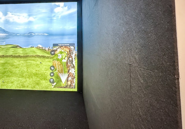 Acoustic tiles installed beside a golf simulator screen