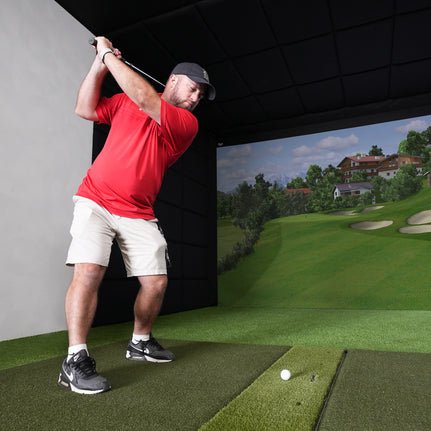 Golfer hitting into a Built-In Golf Room Kit screen